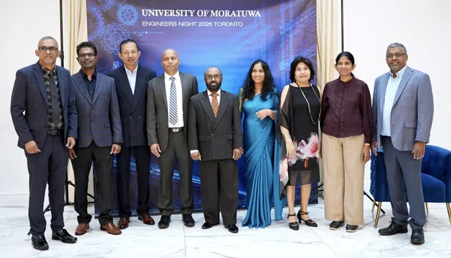 A group portrait in front of the Engineers Night backdrop