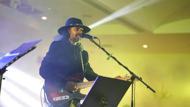 Live vocalist and guitarist performing on stage
