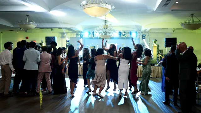 Guests gathered on the illuminated dance floor
